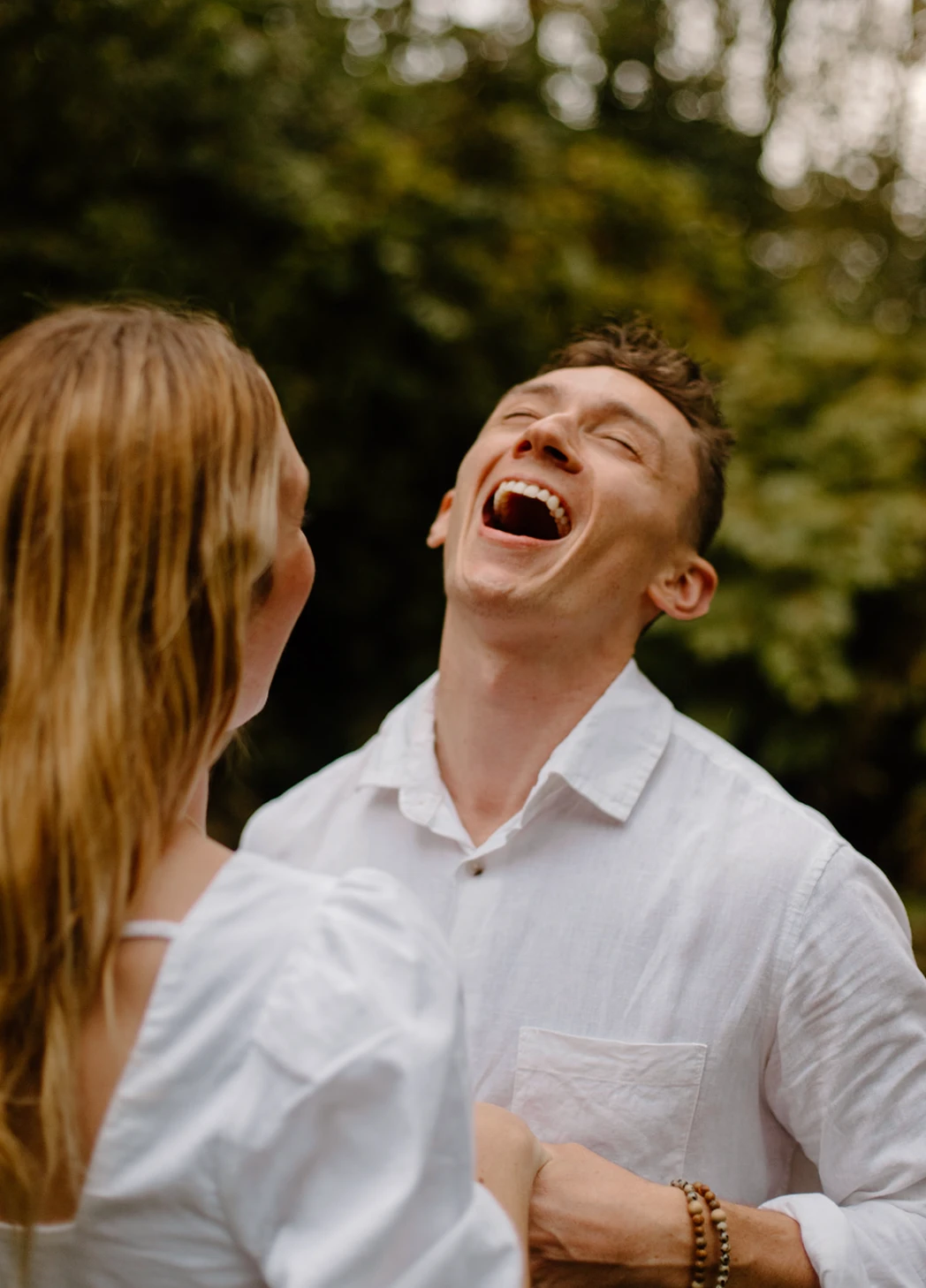 Gerrin laughing with his head thrown back